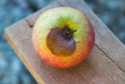 Close-up of apple on wooden table