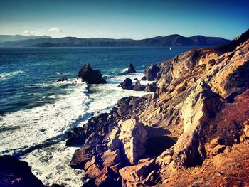 Scenic view of beach against clear sky