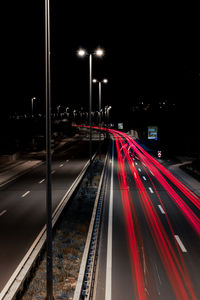 High angle view of light trails on road at night