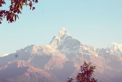 Scenic view of snowcapped mountains against clear sky