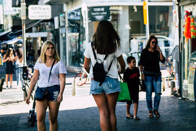 Group of people walking in city