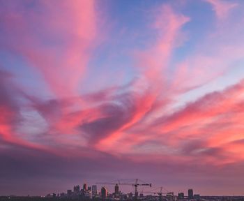 Silhouette built structure against sky during sunset