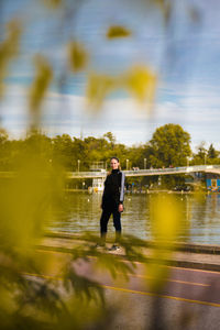 Full length of man standing against trees