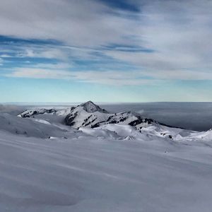 Scenic view of snowcapped mountain against sky