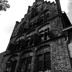 Low angle view of old building against sky