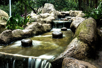 Scenic view of waterfall in river