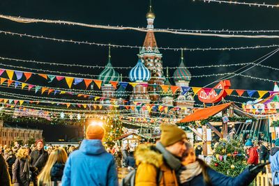 People at illuminated temple in moscow against clear sky at night.  hristmas decorations 