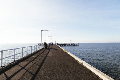 Pier over sea against sky