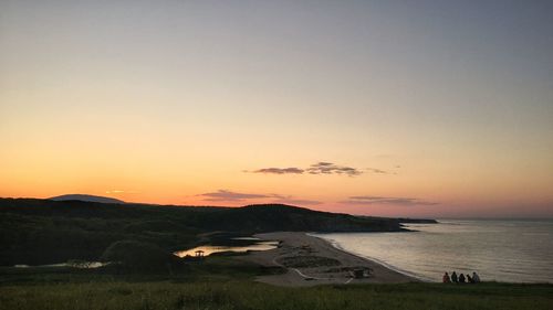 Scenic view of sea against clear sky during sunset