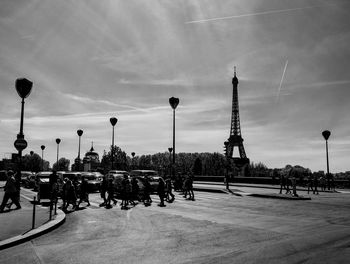 Cars on street against sky