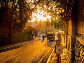 People walking on road in city