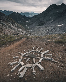 High angle view of land and mountains against sky