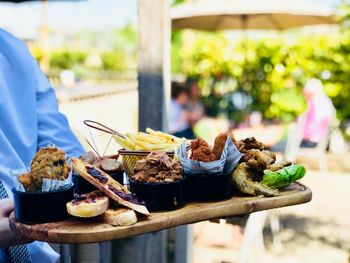 Man eating food on table at restaurant