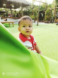 Portrait of cute boy in park