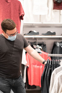 Midsection of man standing in store