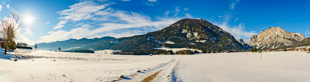 Panoramic view of snowcapped mountains against sky