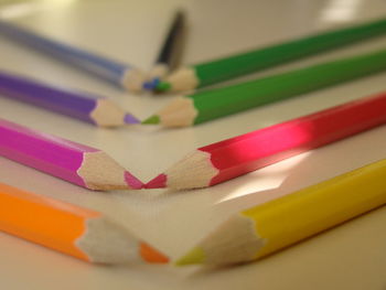 Close-up of colorful pencils on table