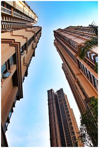 Low angle view of modern buildings against sky