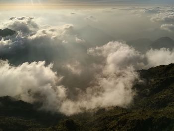 Aerial view of clouds over mountain