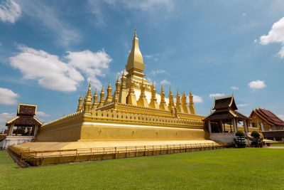 View of temple building against cloudy sky