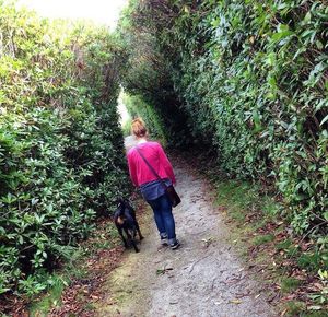 Full length of woman walking on footpath