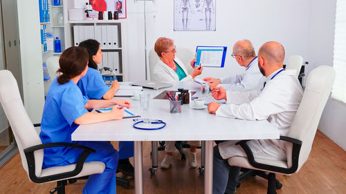 High angle view of doctor working on table