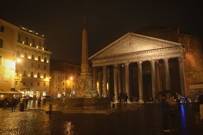 Illuminated fountain at night