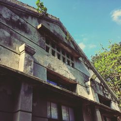 Low angle view of building against blue sky