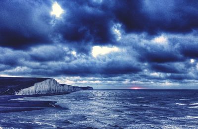 Scenic view of sea against cloudy sky