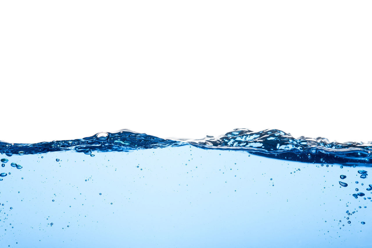 CLOSE-UP OF WATER DROPS ON WHITE BACKGROUND