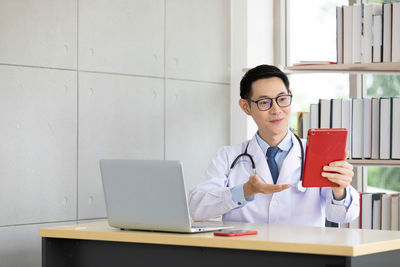 Mid adult man using smart phone