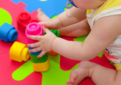 Low angle view of girl playing with toy