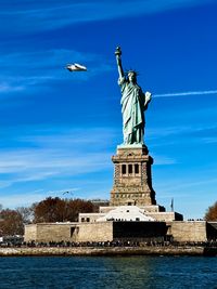 Low angle view of statue against sky