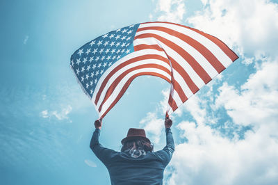 Low angle view of man against sky