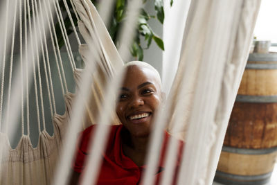 Smiling woman relaxing in hammock