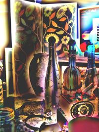 Close-up of wine bottles on table at home