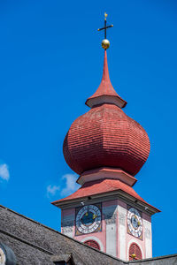 Low angle view of traditional building against blue sky