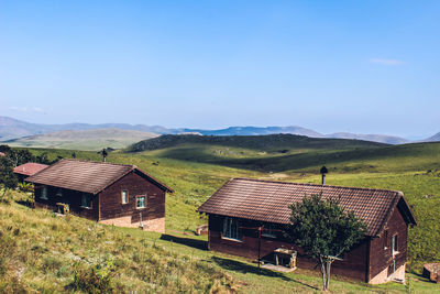 House on field against sky
