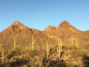 Scenic view of rocky mountains against clear blue sky