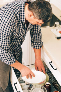 Side view of man working at home