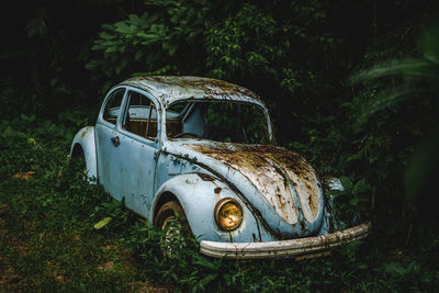 Abandoned car on field