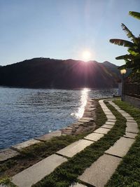 Scenic view of lake against sky during sunset