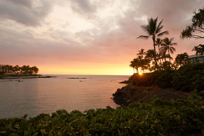 Scenic view of sea against sky at sunset
