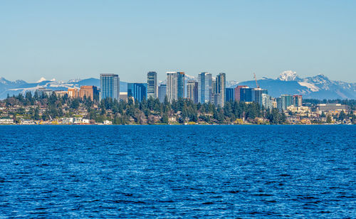 A view of the bellevue, washington skyline across lake washington.