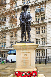 Statue in front of building