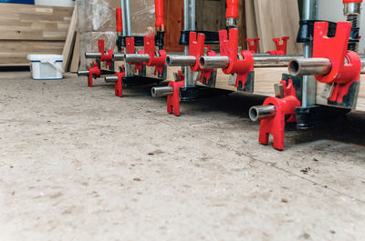 Wooden board in carpentry workshop. joiner's clamp. wood shavings, sawdust