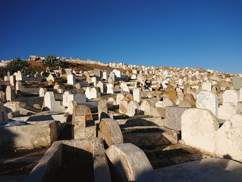 Low angle view of buildings against clear blue sky