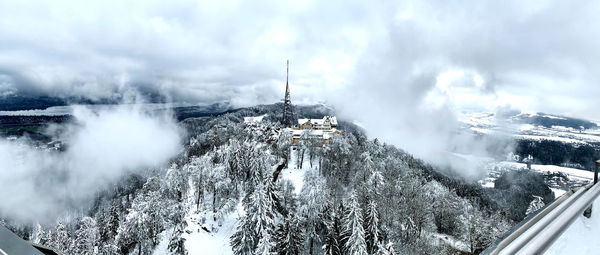 Panoramic shot of snow covered mountain against sky