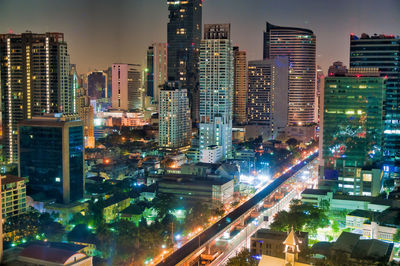 High angle view of illuminated buildings in city at night