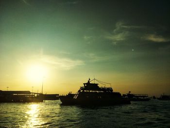 Silhouette of ship at sunset